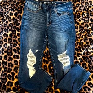Like new American Eagle Skinny jeans with knee rips